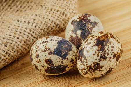Photo for A tray of delicious Quail Eggs isolated on wooden background with copy space - Royalty Free Image