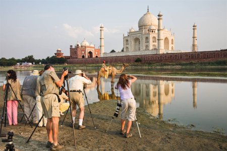 Photo for A group of photographers photographing the world famous Taj Mahal located in Agra, India. South Asia - Royalty Free Image