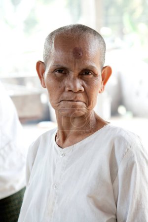 Photo for Portrait of elderly female monk in the Banteay Srei Pagoda Angkor Wat temple complex Cambodia, Southeast Asia - Royalty Free Image