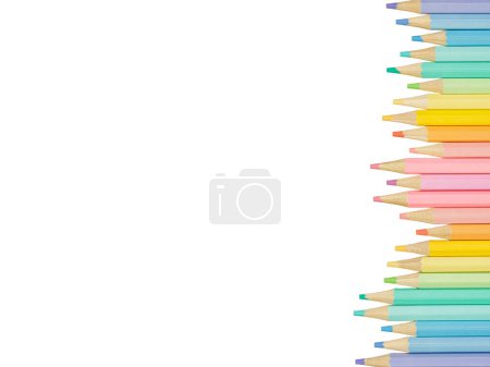 Photo for Top down or flat lay of a boarder of colorful pastel colored pencils isolated on a white background with cop space - Royalty Free Image