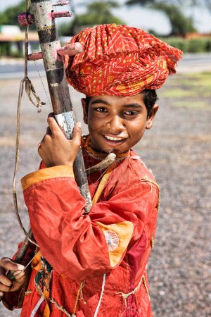 Photo for Indian street musician playing the Sarangi in Rajasthan India, East Asia - Royalty Free Image