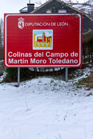Photo for A red sign with the long name of a Spanish town on a snowy day - Royalty Free Image
