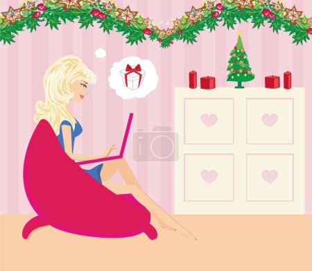 Téléchargez les photos : Achats en ligne de Noël - belle fille se détendre à la maison - en image libre de droit