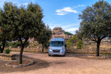Photo for Campervan and castle Morella Spain historic hill top city Castelln Province, Valencian Community - Royalty Free Image