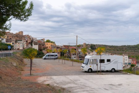Photo for Motorhome and campervan parked at the free Spanish aire area El Masroig Spain Catalonia Tarragona province on Friday 7th October 2022 - Royalty Free Image