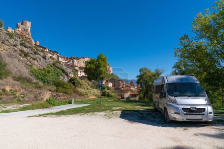 Photo for Motorhome parked in beautiful Spanish aire with service point and view to hilltop castle and church Frias, Burgos province Castile and Leon, Spain - Royalty Free Image