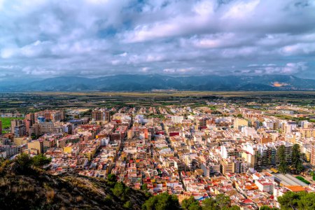 Photo for Cullera Spain view of the town with streets and buildings from the castle with view to mountains - Royalty Free Image