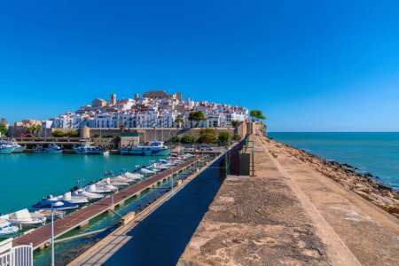 Peniscola port and castle view Costa del Azahar Spain historic town and harbour wall