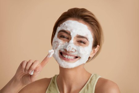 Photo for Face Skin Care. Happy Caucasian Woman Posing with Foam Soap on Face. Positive Girl Cleansing Face Applying Facial Cleanser Closeup. Cleaning Facial Skin Concept. High Resolution - Royalty Free Image