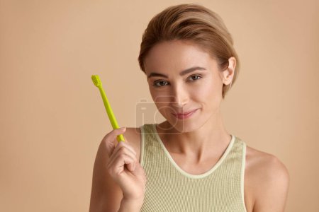 Photo for Healthy White Teeth. Closeup Portrait Of Beautiful Smiling Woman Holding Toothbrush With Toothpaste. Dental Health Care Concept. High Resolution Image - Royalty Free Image