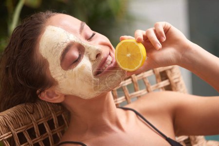 Photo for Face Mask Girl Hold Slice of Lemon. Happy Young Relaxed Woman Enjoying Skin Care Routine . Concept of Skincare - Royalty Free Image