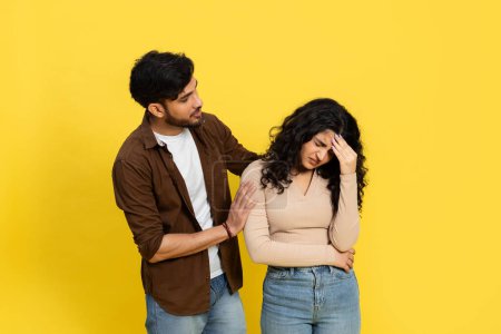 Photo for Man Comforting Upset Woman Against Yellow Background, Relationship Support, Consoling, Empathy, Stress, Couple Problem, Reassuring - Royalty Free Image