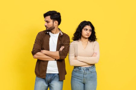 Photo for Conflict And Resolution Concept With Unhappy Couple Standing Back To Back, Misunderstanding In Relationships, Against A Yellow Background - Royalty Free Image