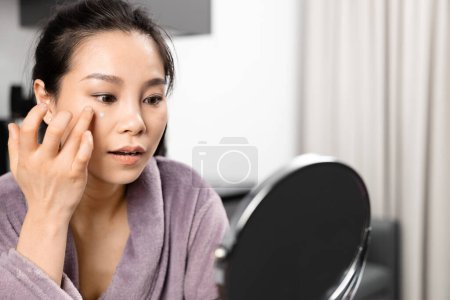 Photo for Woman In Bathrobe Doing Morning Beauty Routine At Home - Royalty Free Image