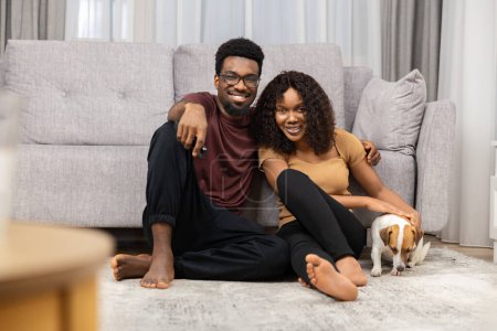 Happy Couple And Dog Sitting On Living Room Floor, Casual Lifestyle, Pet Owner, Home Comfort