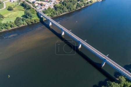 Photo for Aerial view of the international bridge over the Minho river between the Spanish town of Tui and the Portuguese town of Valenca do Minho. - Royalty Free Image
