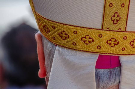 close-up view from behind of the head of a catholic bishop