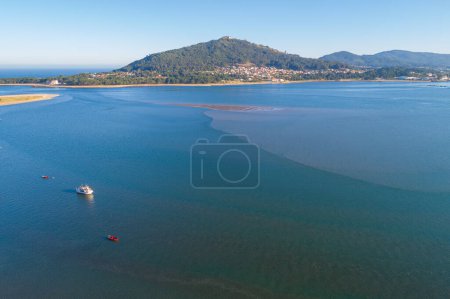 aerial view with drone of the mouth of the Minho river and Santa Tecla mountain. From the municipality of Caminha, Portugal.