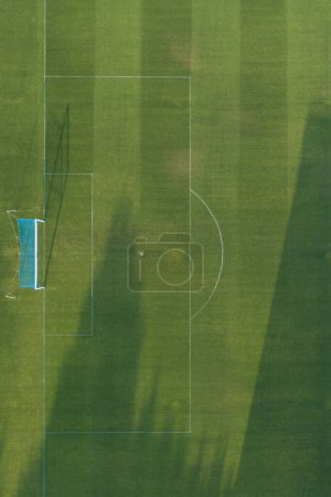 Aerial view of a grass football field goal