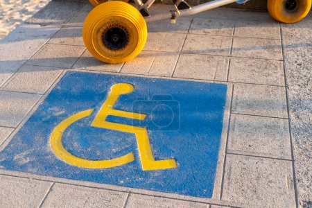 sign painted on the ground of a care point for people with reduced mobility