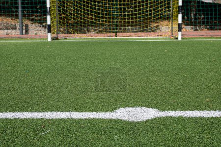 goal and penalty area of an artificial turf football field