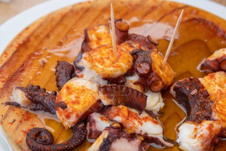 Photo for Ration of pulpo a feira, typical Galician recipe for cooking octopus. - Royalty Free Image