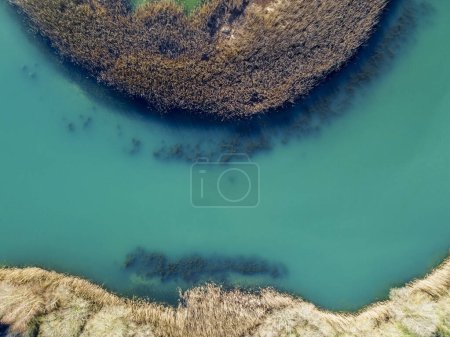 aerial view of turquoise water marshes