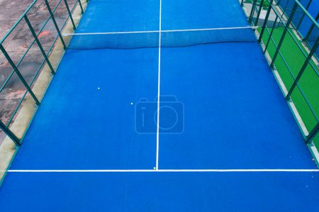 blue paddle tennis court aerial photo with drone