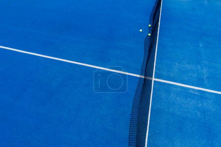 blue paddle tennis court aerial view with drone