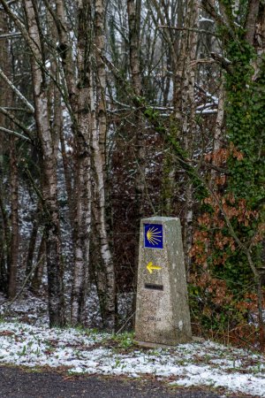 Signpost for pilgrims on the Way of St James, snowy day