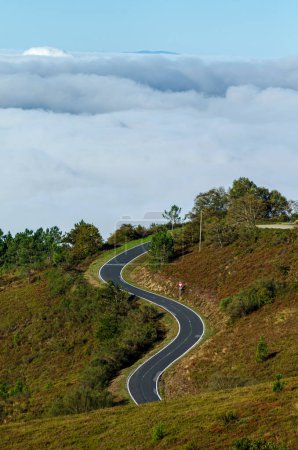 curves on a mountain road on a cloudy day