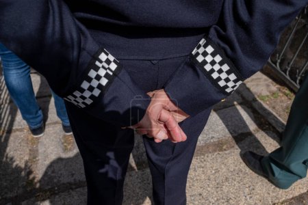 close-up view of the hands of a local police officer