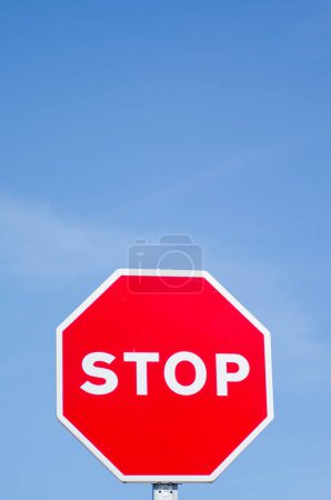 isolated stop signal with blue sky background