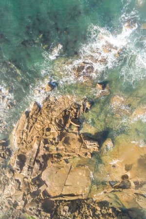 aerial top view of a rocky coastline, drone photography