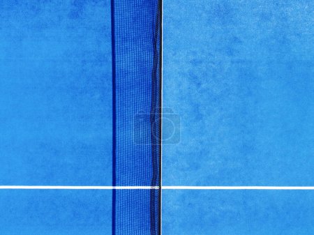 blue paddle tennis court, directly above partial aerial drone view