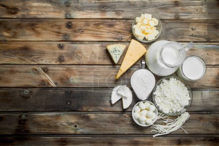 Photo for Variety of fresh dairy products. On a wooden background. - Royalty Free Image