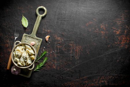 Photo for Beef dumplings in the bowl. On dark rustic background - Royalty Free Image