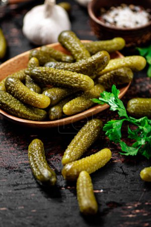 Photo for Homemade pickled cucumber on the table. On a rustic dark background. High quality photo - Royalty Free Image