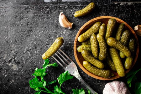 Photo for Wooden plate with pickles. On a black background. High quality photo - Royalty Free Image