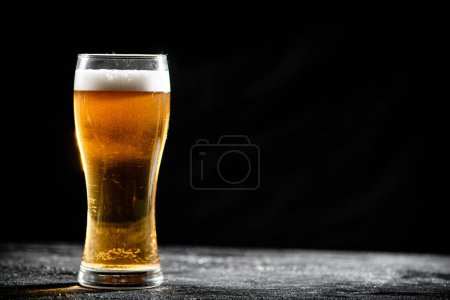 Photo for Glass with beer . On rustic background. - Royalty Free Image