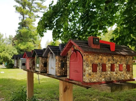 Unique handcrafted mailboxes in Charlevoix designed to resemble the famous stone "mushroom" homes 