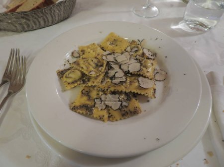 Photo for Vegetarian ravioli aka agnolotti with vegetables filling and black truffle, traditional Italian pasta food - Royalty Free Image