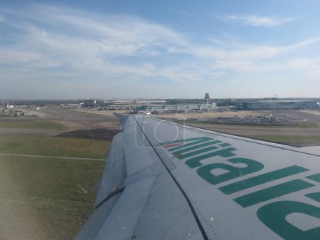 Photo for ROME, ITALY - CIRCA OCTOBER 2019: taking off from Rome Fiumicino on a former Alitalia aircraft - Royalty Free Image