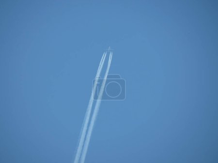 Photo for VIENNA, AUSTRIA - CIRCA JUNE 2022: Airbus A380 flying. Condensation trails produced by its four engines are clearly visible even from long distance - Royalty Free Image