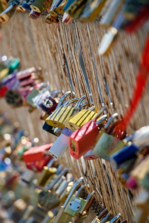 Photo for Engraved and Marked Locks hanging in the Pot Des Arts or Inlove ones Bridge - Royalty Free Image