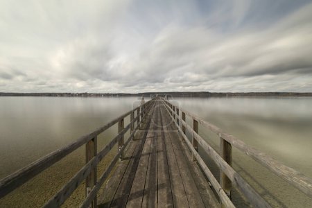 Wooden jetty at lake Ammersee in Bavaria, Germany