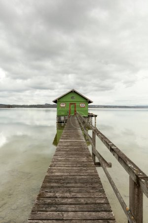 Boathouse and jetty at lake Ammersee in Bavaria, Germany