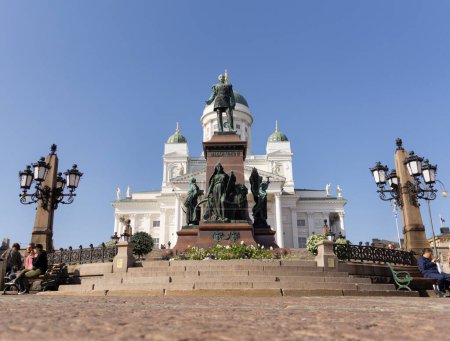 Photo for Alexander II monument with helsinki lutheran cathedral and blue sky at background in sunny day - Royalty Free Image