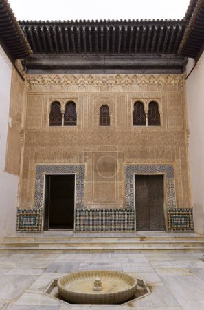 Photo for Comares palace small interior yard with a font and islamic architecture facade details - Royalty Free Image
