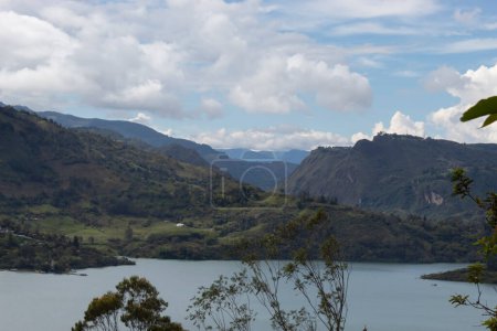 Photo for Beautiful colombian andean mountains and lake reservoir landscape in blue sunny day - Royalty Free Image